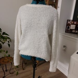 Fuzzy off-white longsleeve sweater.